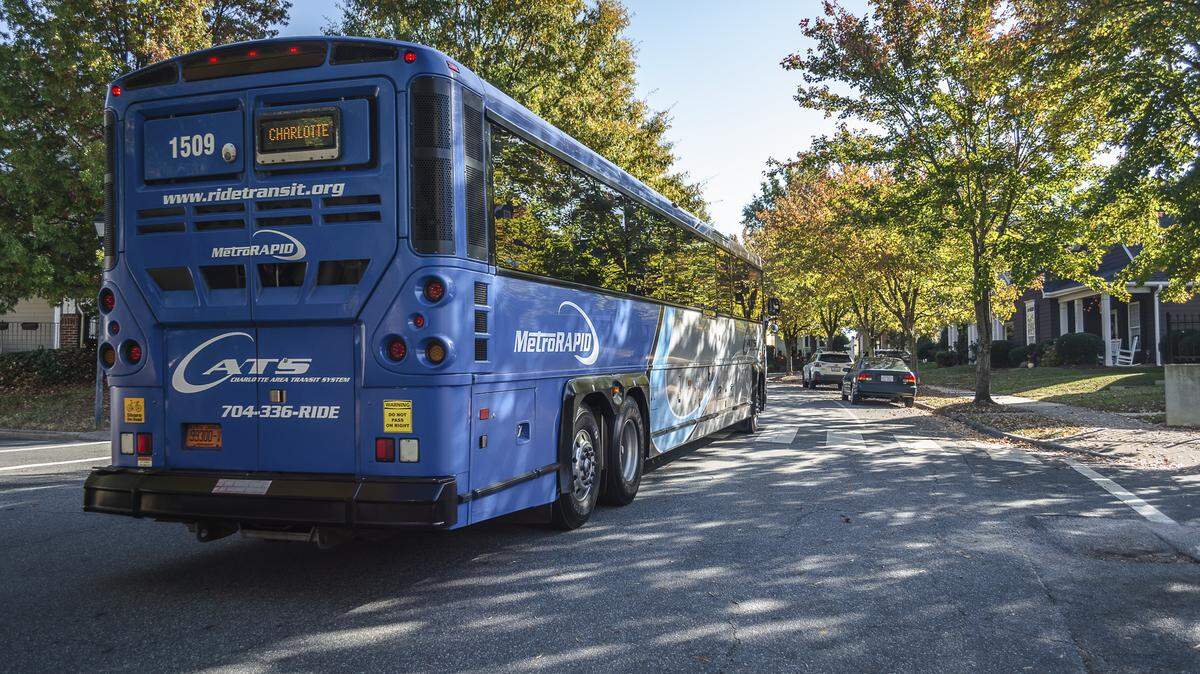 A CATS express bus travels a Charlotte street.