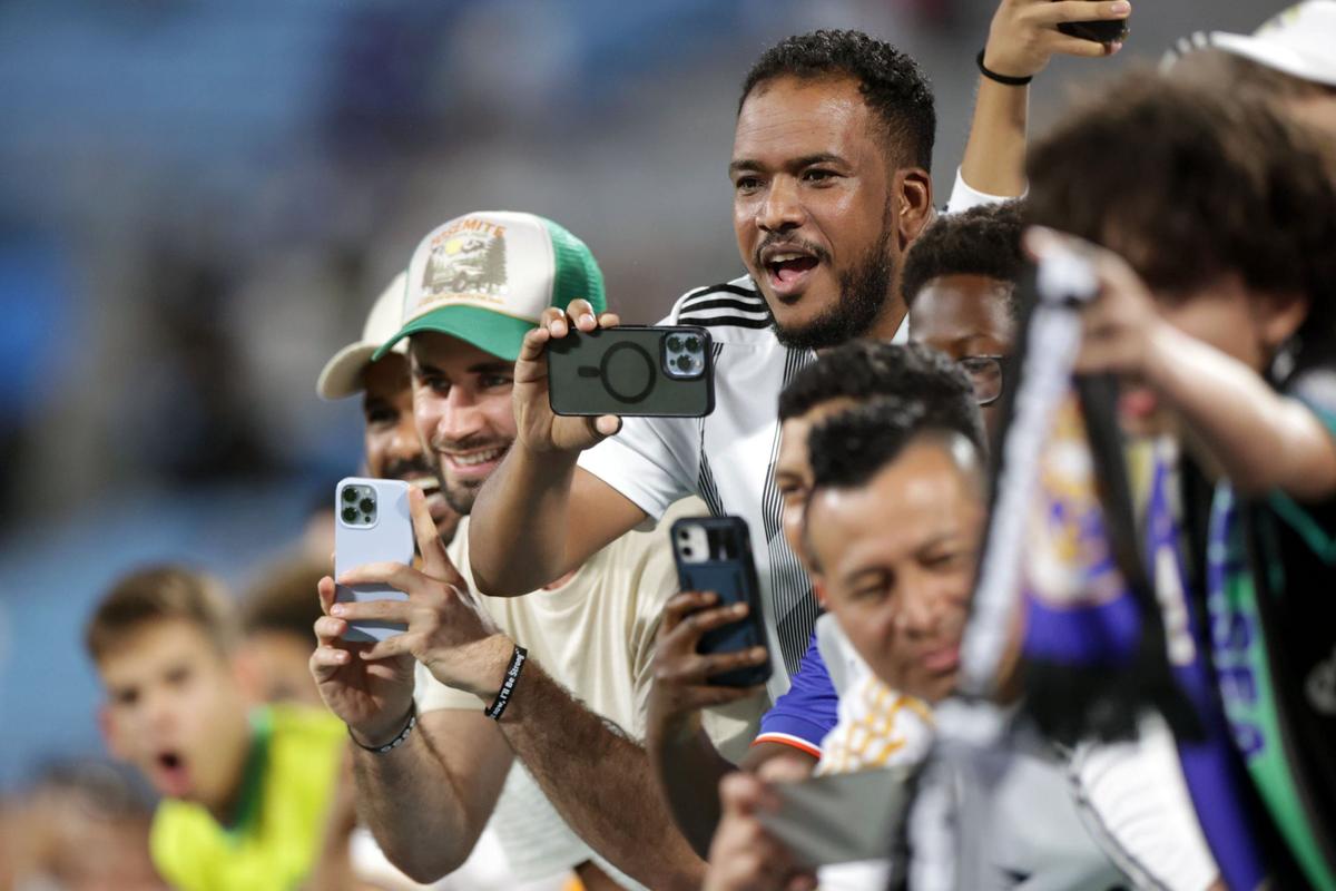 Fans huddle for autographs after the Real Madrid v. Chelsea game at the Bank of America stadium on August 6, 2024.