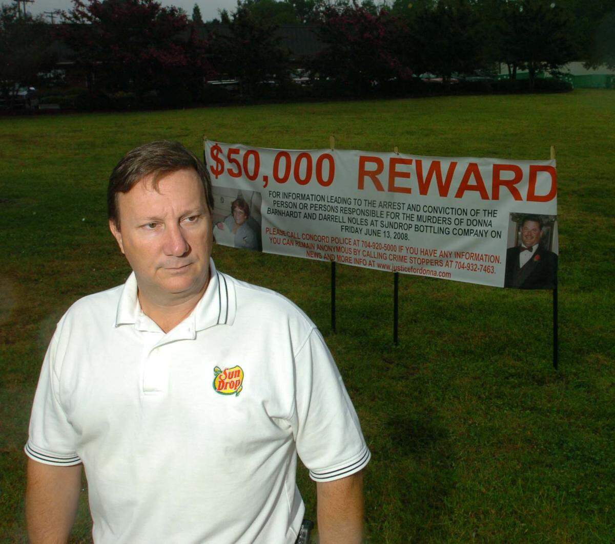 Sun Drop Bottling Co. CEO John King, in front of  a$50,000 reward sign on the property of Sun Drop Bottling in Concord, in this 2008 file photo.