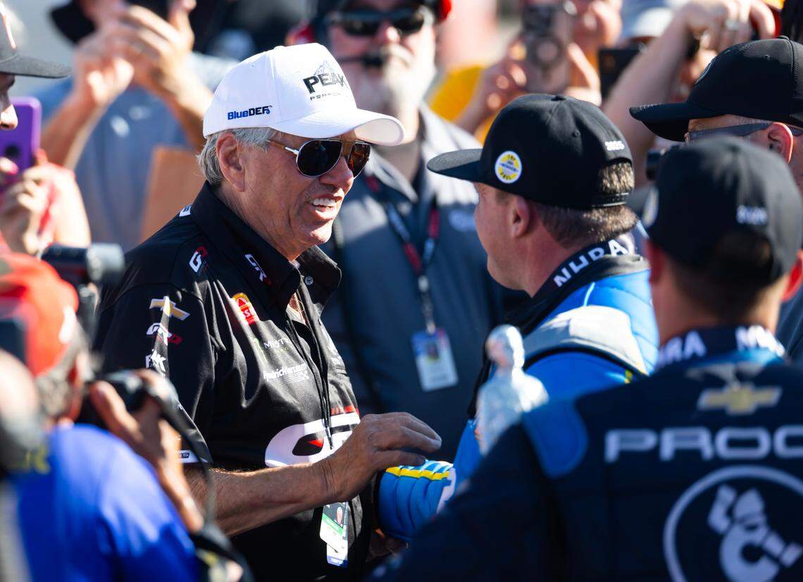 NHRA top fuel driver Tony Stewart (right) is congratulated by John Force after winning the Four Wide Nationals at The Strip at Las Vegas Motor Speedway. Mark J. Rebilas-Imagn Images