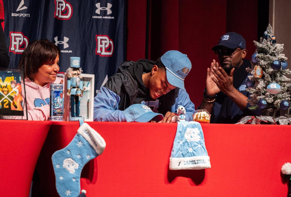 Jordan Shipp signs to UNC Chapel Hill during a ceremony for Providence Day’s early college signees Charlotte, N.C., on Friday, December 8, 2023.