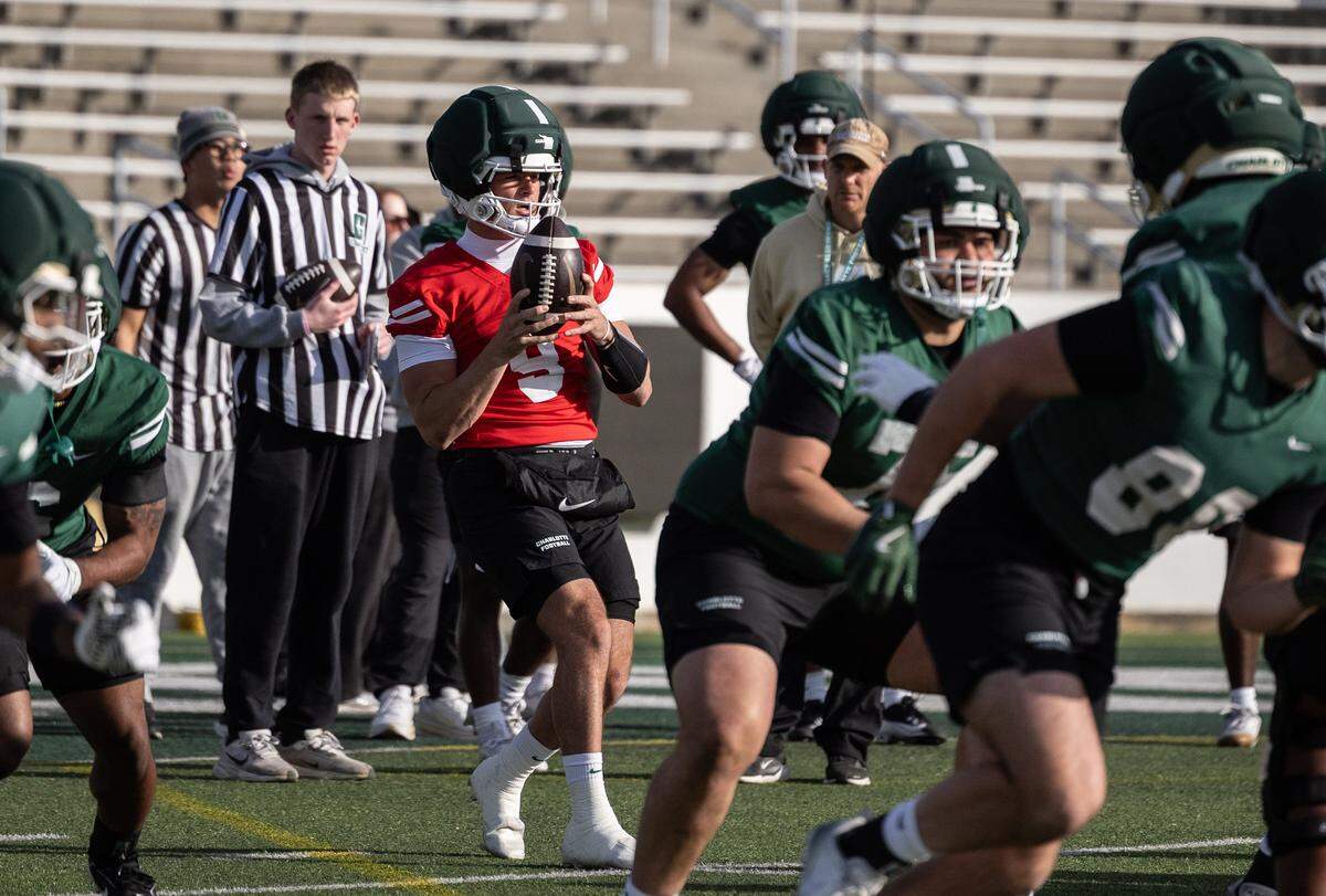 Charlotte 49ers Cole Gonzalez looks to pass during Charlotte 49ers open spring football practice at Jerry Richardson Stadium in Charlotte, N.C., on Tuesday, March 24, 2026.