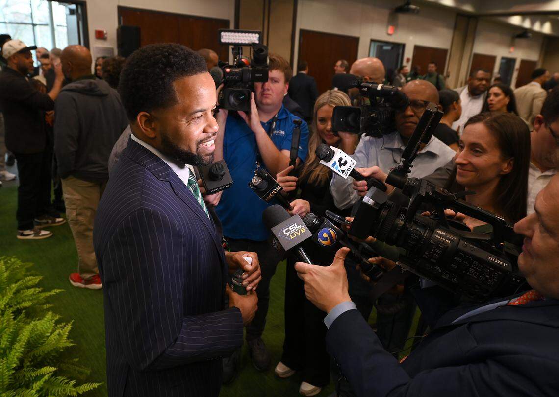 New Charlotte 49ers athletic director Kevin White, left, speaks with local media following his introductory news conference Thursday afternoon.