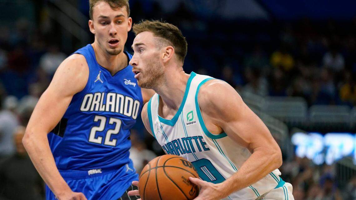Charlotte Hornets’ Gordon Hayward, right, moves to the basket against Orlando Magic’s Franz Wagner (22) during the first half of an NBA basketball game, Wednesday, Oct. 27, 2021, in Orlando, Fla. (AP Photo/John Raoux)