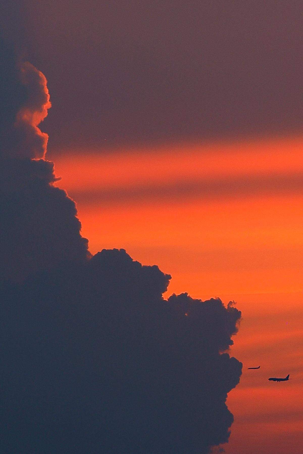 Planes make their approach into Charlotte Douglas International Airport at sunset on Monday, June 13, 2022. Monday’s high of 98 at the airport broke the previous record of 97 set in 1958. Tuesday was supposed to be hotter, but morning storms kept the high under 100.