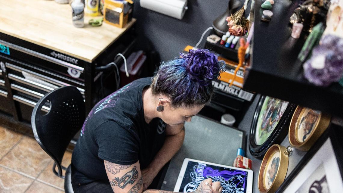 Jasmine Waller, a tattoo artist at Tattoo Bill’s works on a drawing Wednesday. Tattoo Bill’s won the The Charlotte Observer’s 2023 Readers’ Choice best tattoo shop contest.