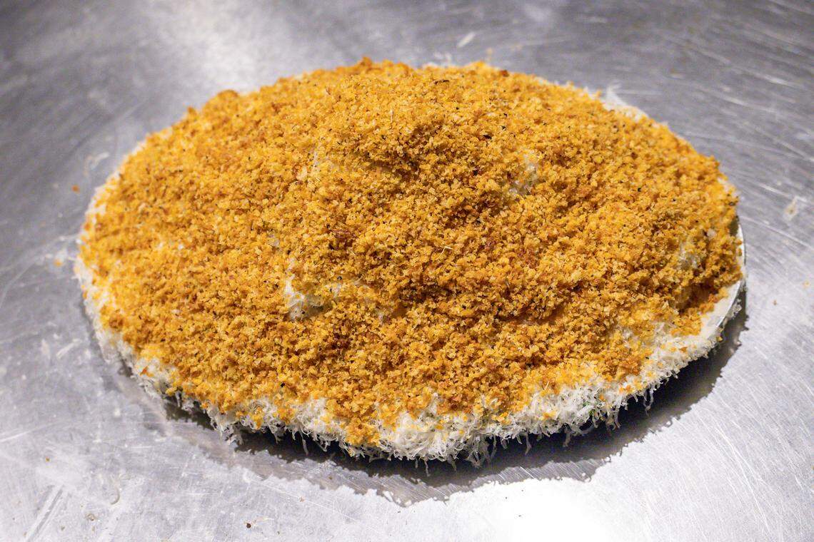 The kale salad at Bird Pizzeria has house dressing on properly massaged kale with freshly grated Grana Padano cheese and house-made crouton crumbs.