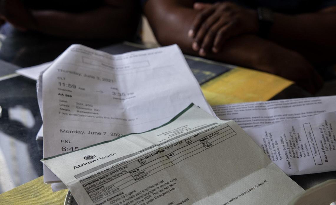 Melanie and DaJuan Savage’s ’s flight information and negative COVID-19 test results are seen in their Charlotte home on Friday, June 11, 2021.