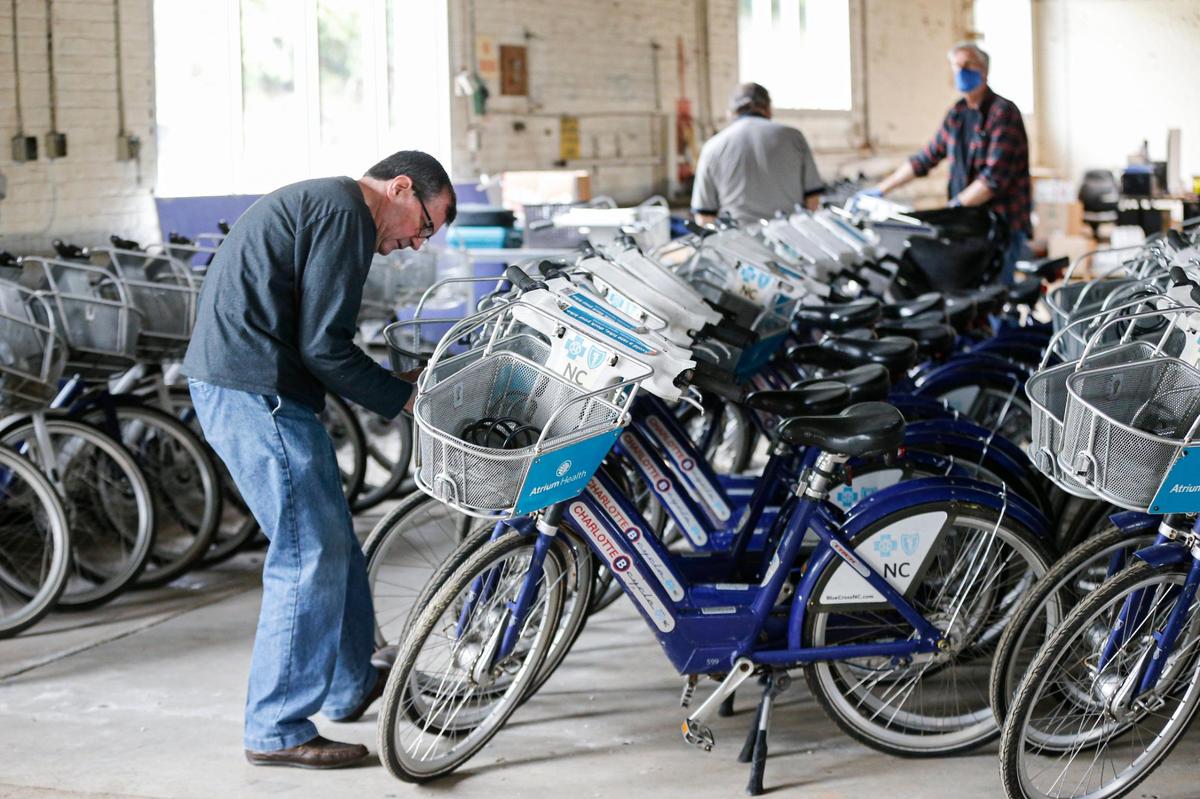 Brad Patterson works on bicycles that will be restored and donated to Roof Above.