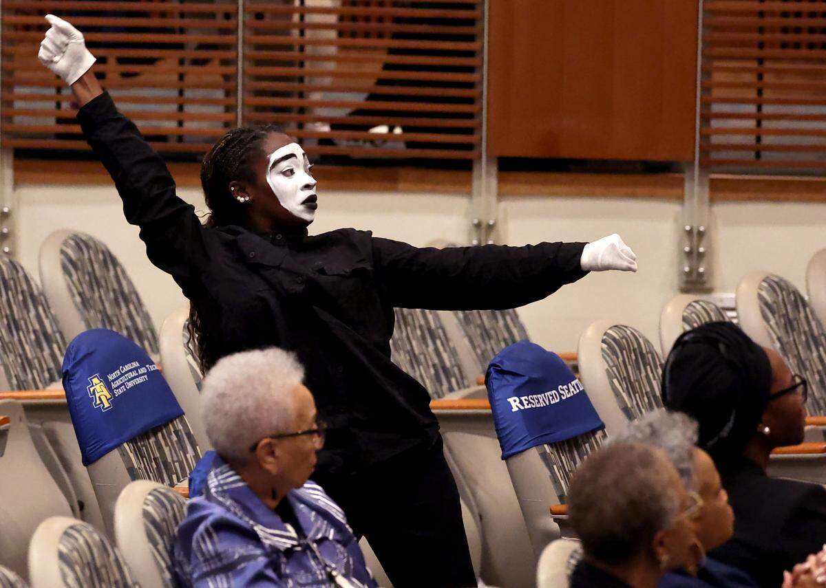 A NC A&T Fellowship Gospel Choir interpretative dancer performs with others during a memorial service for Maj. Gen. Joseph McNeil at North Carolina A&T State University in Greensboro on Thursday, September 11, 2025.