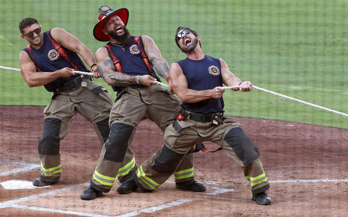 Firefighters battle a young fan during pregame festivities at Truist Field in Charlotte, NC on Thursday, June 4, 2026. Banana Ball action returned to the Queen City with the Texas Tailgaters battling the Firefighters.