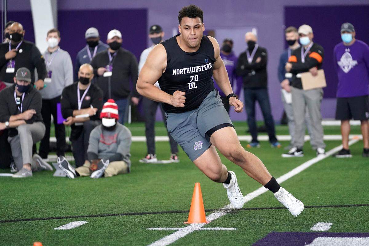 Northwestern offensive lineman Rashawn Slater participates in the school’s Pro Day football workout on March 9, 2021.
