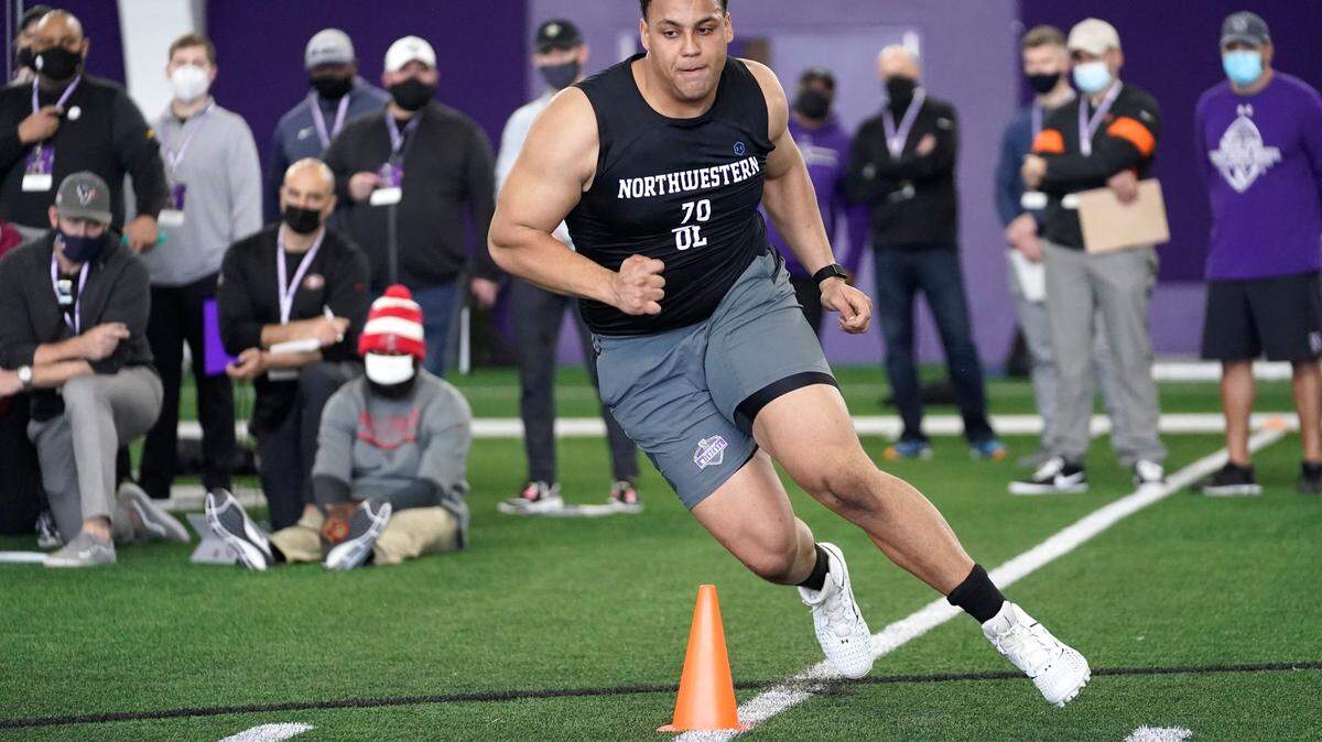Northwestern offensive lineman Rashawn Slater participates in the school’s Pro Day football workout on March 9, 2021.