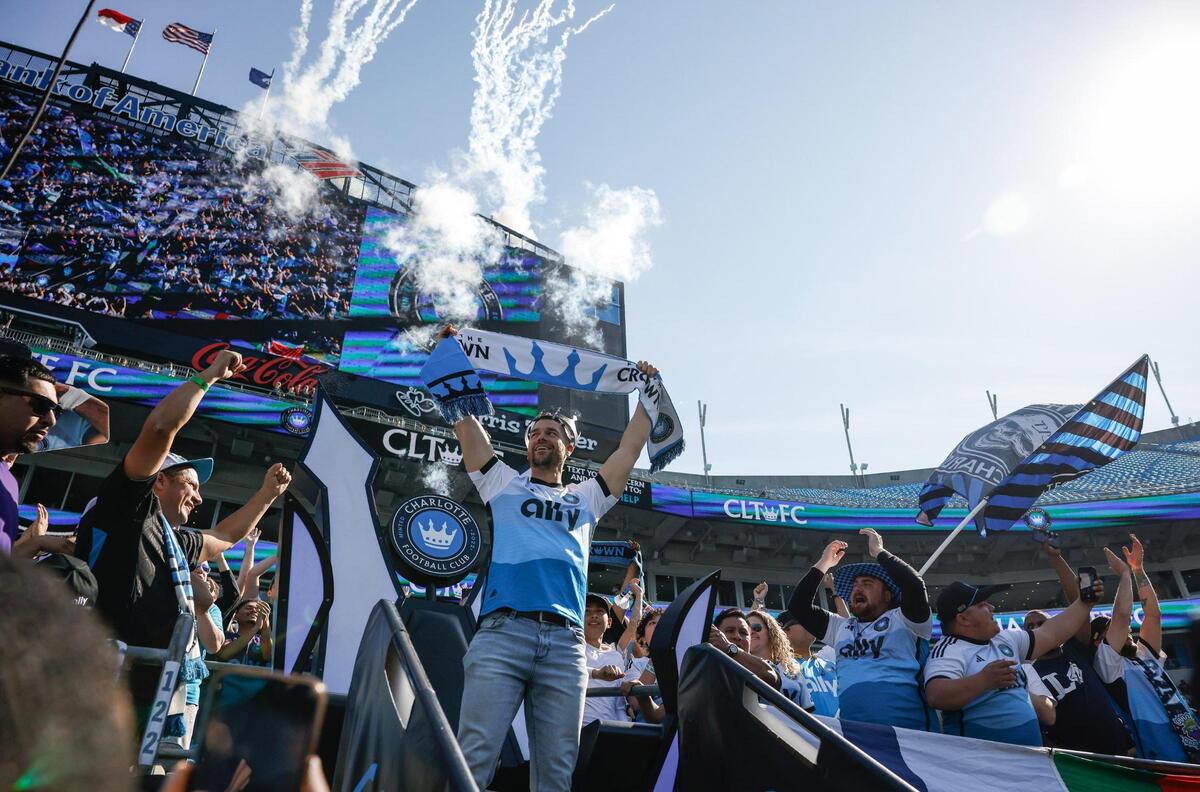 Panthers head coach Dave Canales gets the crowd hype during the coronation ceremony before Charlotte FC’s home opening match against Atlanta United at Bank of America Stadium in Charlotte, NC on Saturday, March 1, 2025.