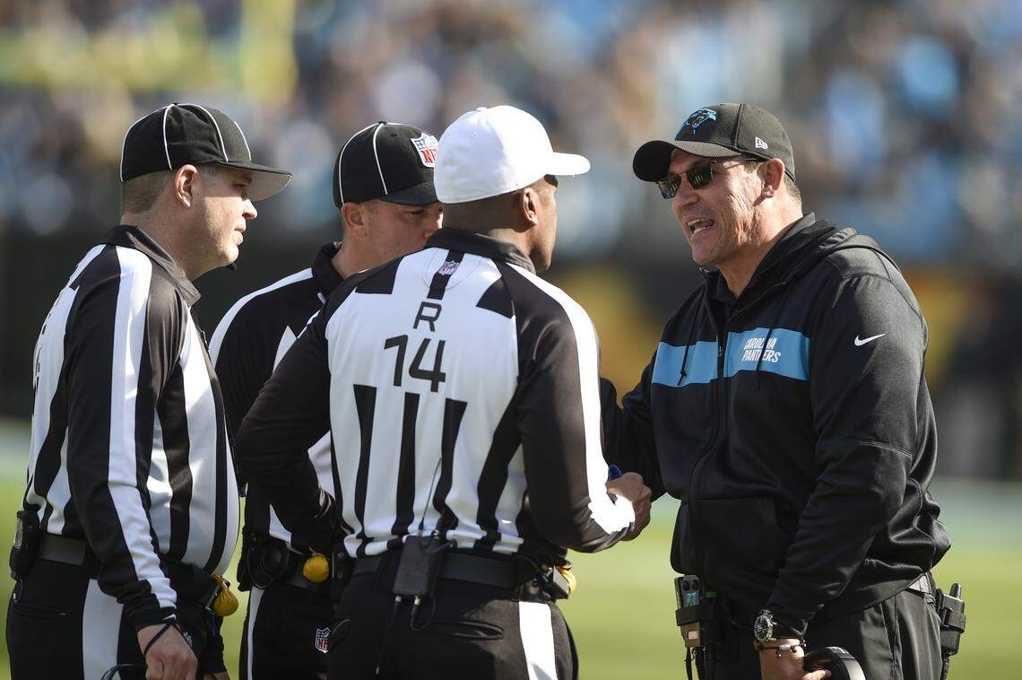 Carolina Panthers head coach Ron Rivera talks with officials during the first half of an NFL football game against the Seattle Seahawks in Charlotte, N.C., Sunday, Nov. 25, 2018. (AP Photo/Mike McCarn)