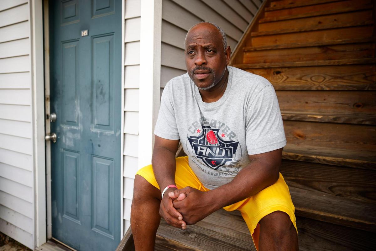 Rory Pegram, of Charlotte, N.C., near his room in the Stay Lodge extended stay hotel in Charlotte, N.C., Tuesday, May 31, 2022. Pegram is a solid waste worker for the City of Charlotte and cannot find adequate housing in the city with his current salary.