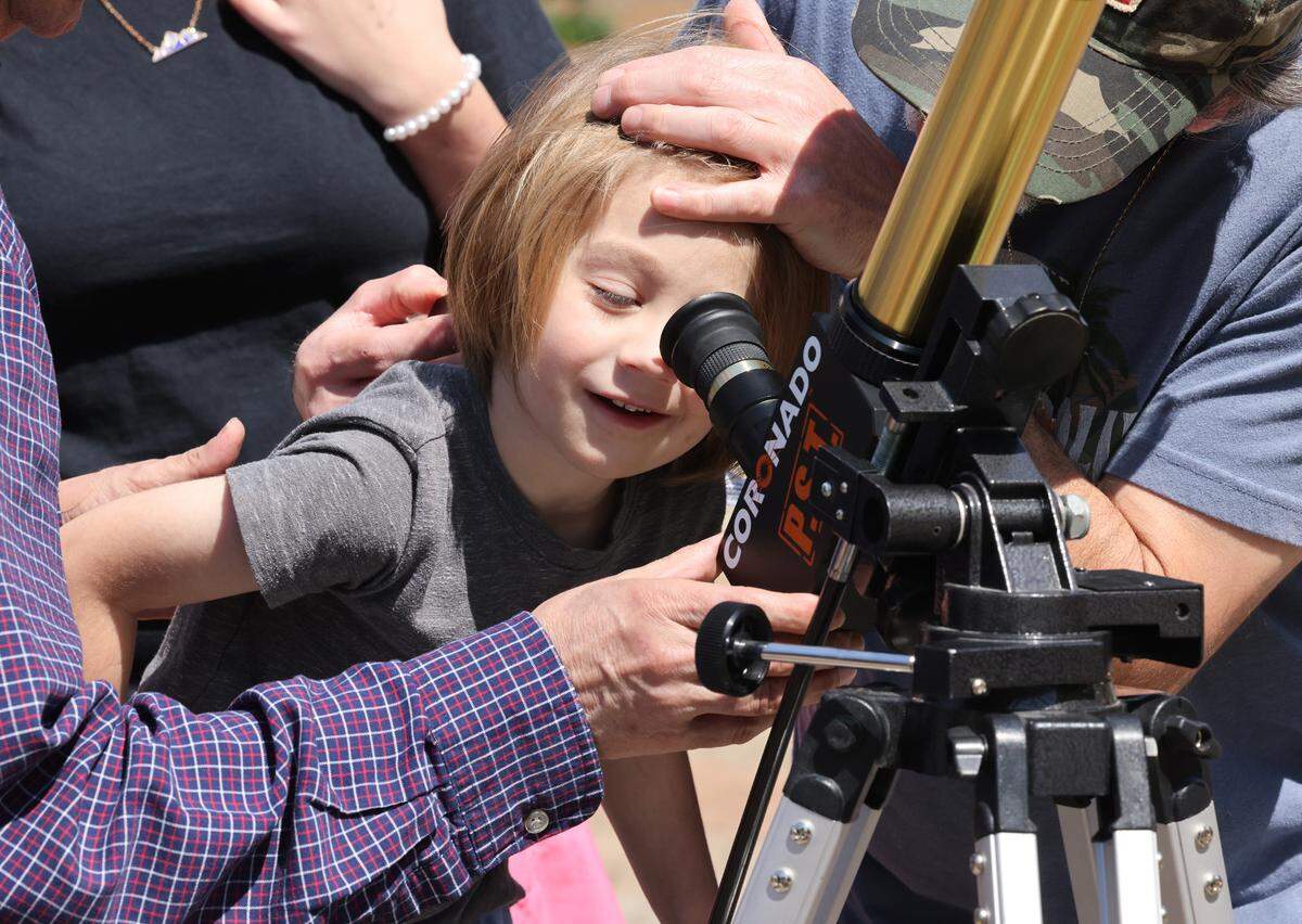 3-year-old Dimitri Kakouras looks through a Museum of York County telescope Monday at the Old Town Amphitheater in downtown Rock Hill.