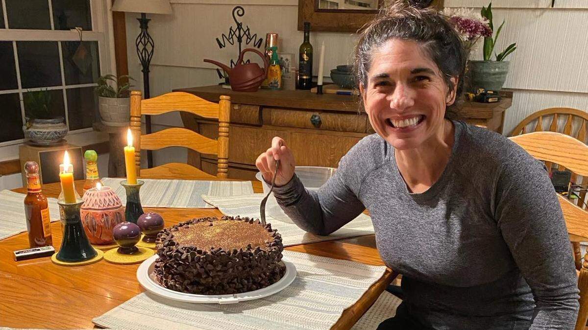 Sarah Smith, a neighbor of Pies by Di owner Diana Cassel in Hendersonville, prepares to celebrate with a birthday cake Cassel baked for her in a toaster oven.