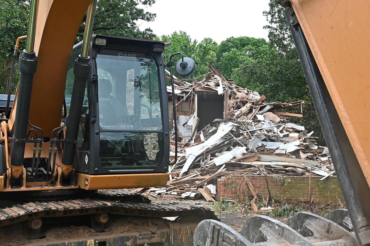 The former Steele Creek Presbyterian Manse sits in a pile of rubble after being demolished along Steele Creek Road in Charlotte, NC.
