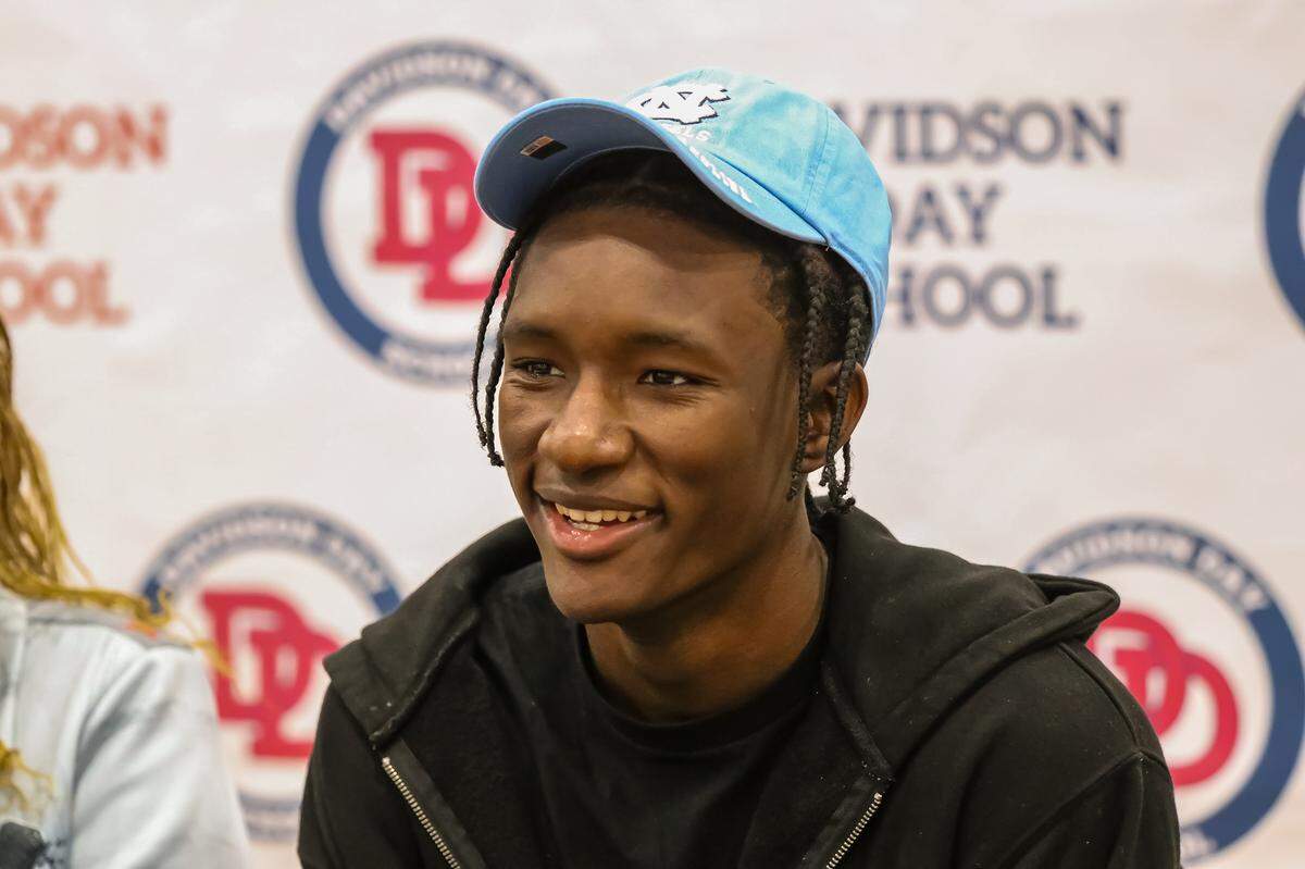 Isaiah Denis is all smiles for fans after announcing his choice to attend UNC to play basketball during his college commitment day event on Saturday Nov 2nd at Davidson Day School in Davidson, North Carolina