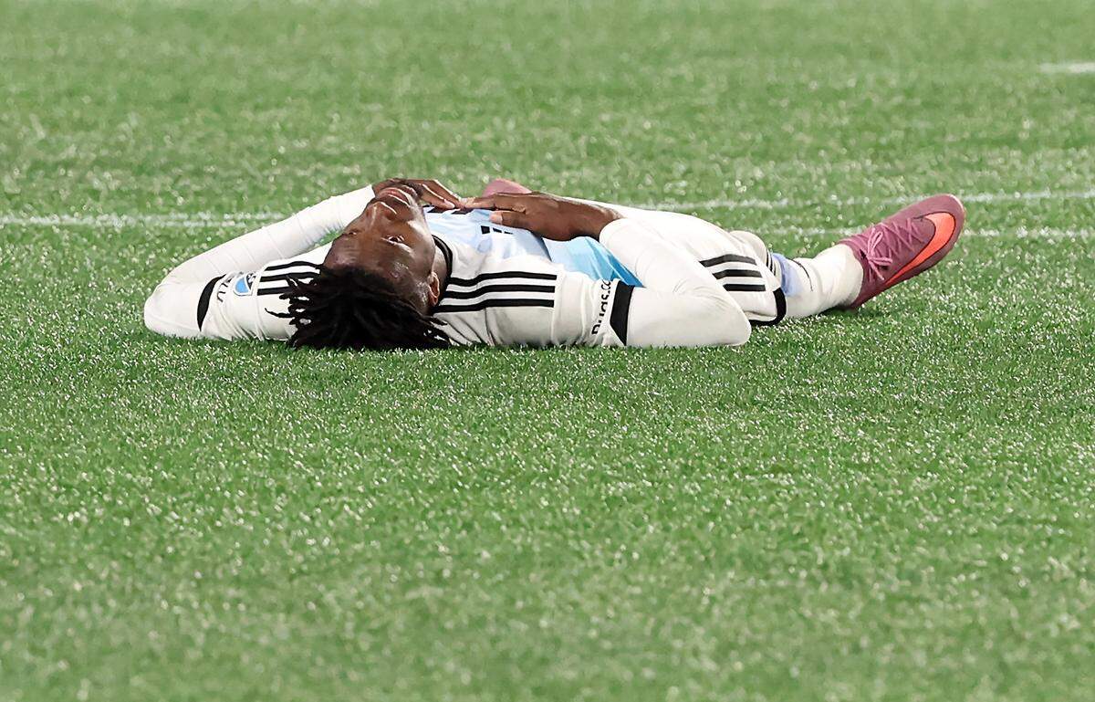 Charlotte FC left wing Wilfried Zaha lays on the pitch at Bank of America Stadium following the team’s 3-1 loss to New York City FC in Game 3 of the MLS Playoffs in Charlotte, NC on Friday, November 7, 2025.