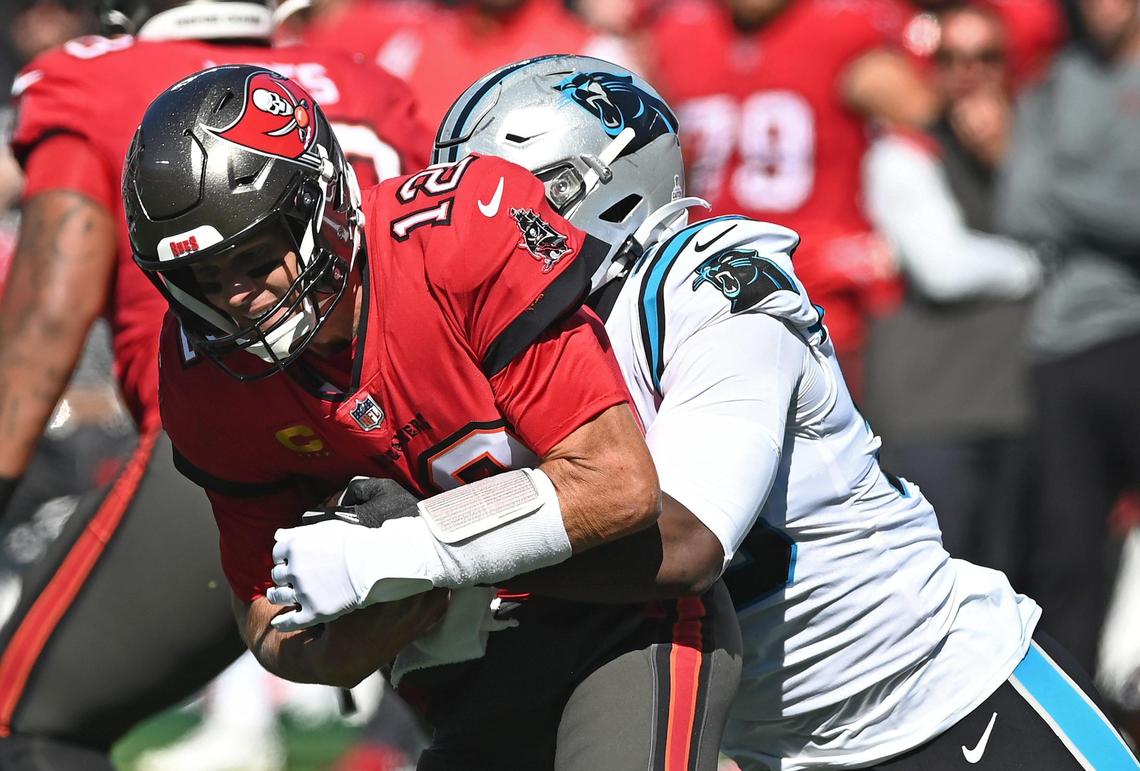 Carolina Panthers defensive end Brian Burns sacks Tampa Bay Buccaneers quarterback Tom Brady during second quarter action at Bank of America Stadium in Charlotte, NC on Sunday, October 23, 2022.