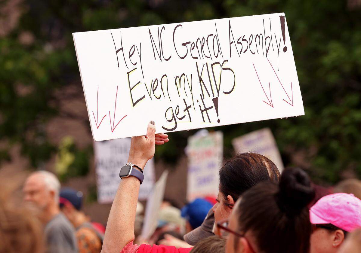 Signs, signs, signs were everywhere as teachers rallied at the Government Complex in Raleigh.