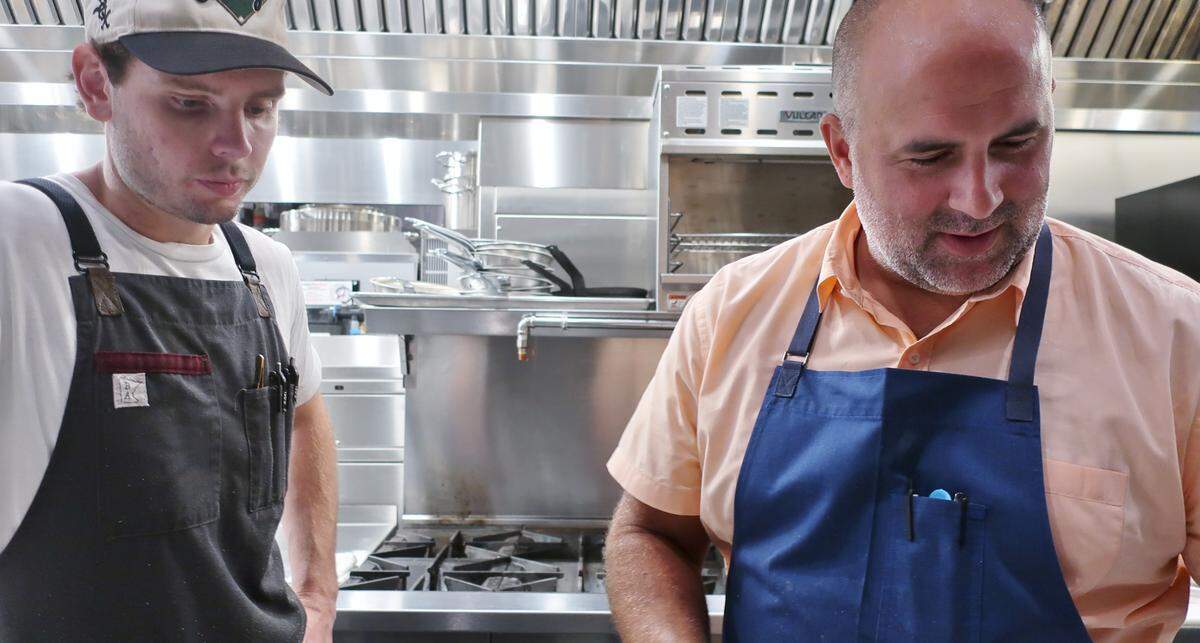 Co-owner Joe Kindred, right, works in the kitchen alongside his staff at Albertine.