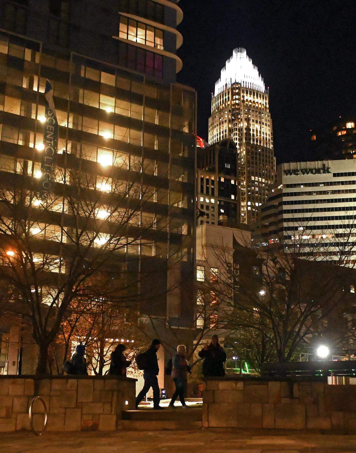 Point-in-Time Count volunteers walk through Romare Bearden Park in uptown Charlotte, NC., on Thursday, January 26, 2023. Volunteers aim to get an accurate statistic of how many people in Charlotte are experiencing homelessness, live in shelters or tents or cars, or otherwise have unstable housing arrangements.