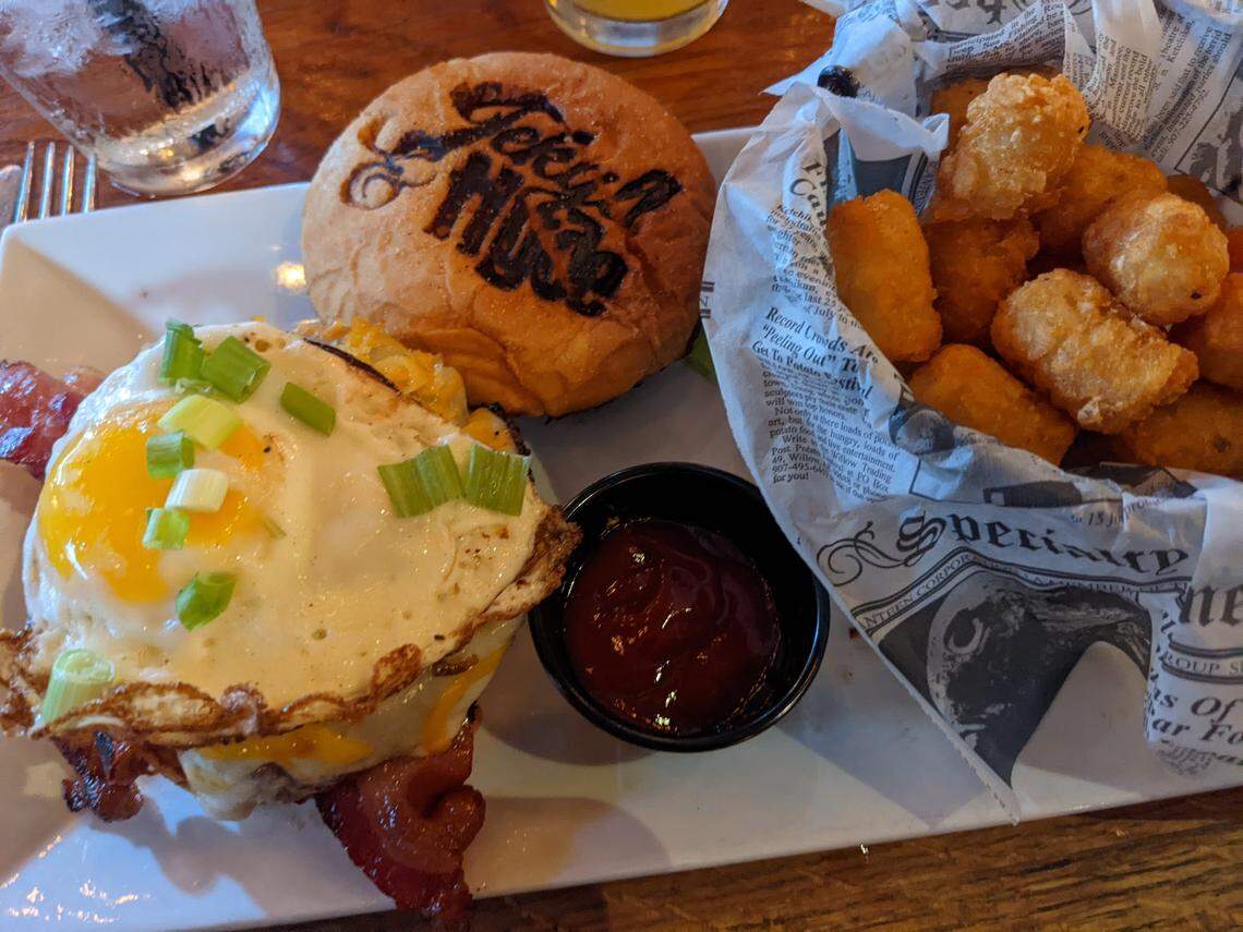 Jekyll & Hyde Taphouse Grill’s Brekkie, with candied bacon, English bacon, cheeses and an egg on top.