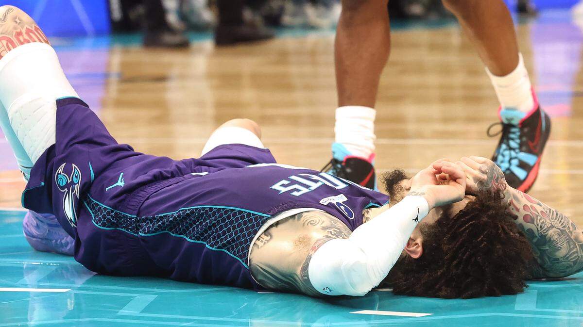 Charlotte Hornets star guard LaMelo Ball lays on the court as the buzzer sounds in the team’s 114-112 loss to the Indiana Pacers at Spectrum Center in Charlotte, N.C. on Thursday, January 8, 2026. 