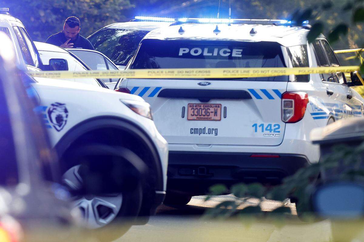 Charlotte-Mecklenburg police officers investigate a scene in Charlotte on Thursday, Sept. 15, 2022.