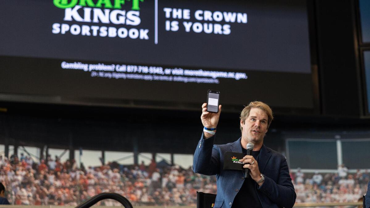 Panthers legend Greg Olsen makes the first bet on DraftKings as sports betting goes live in North Carolina at NASCAR Hall of Fame in Charlotte, N.C., on Monday, March 11, 2024.