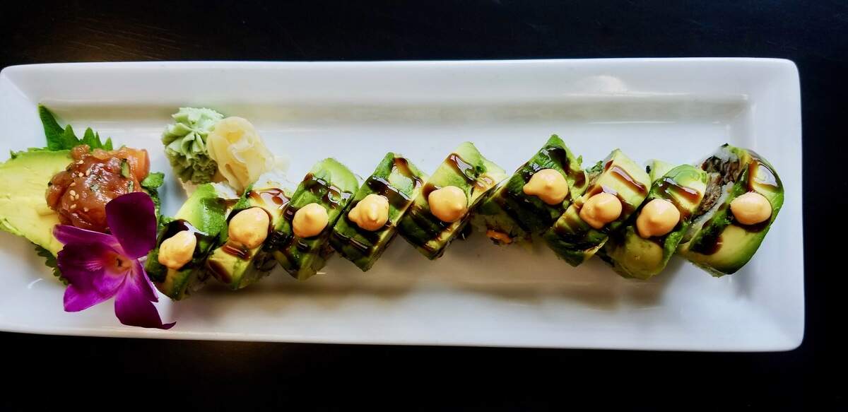 The Riverboat Ron Roll at Cowfish and eeZ Fusion Sushi has a crunchy filling of softshell crab and kani (crab stick) wrapped in thinly sliced avocado and topped with spicy mayo and eel sauce.
