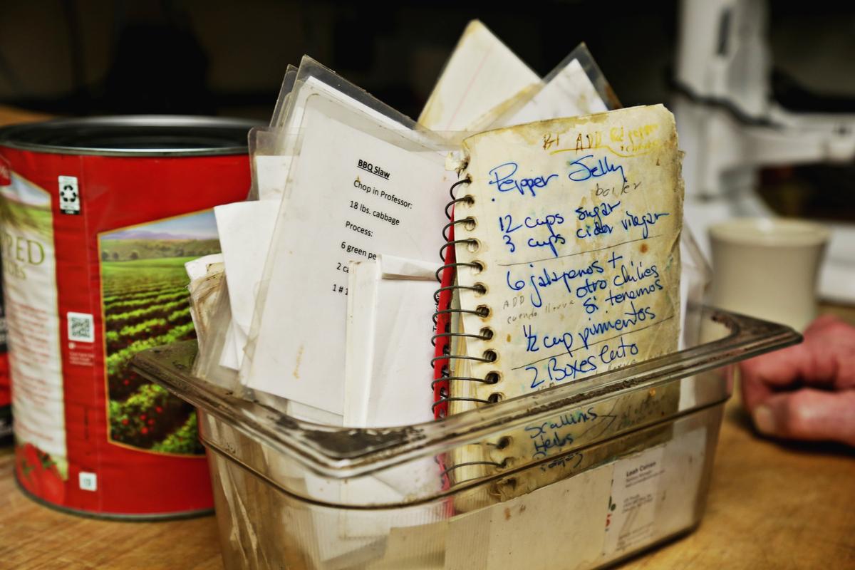 Handwritten and laminated recipes sit on the counter in the kitchen at Crook’s Corner in Chapel Hill on Thursday, Oct. 4, 2018.