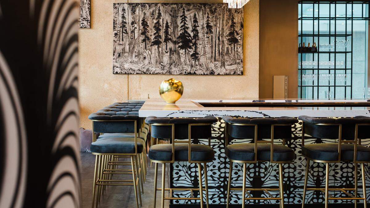 Mariposa, a new restaurant by Mother Earth Group, opened in October 2022. The space is modern and relaxing, with black and white decor and artwork by Charlotte muralist Owl. 