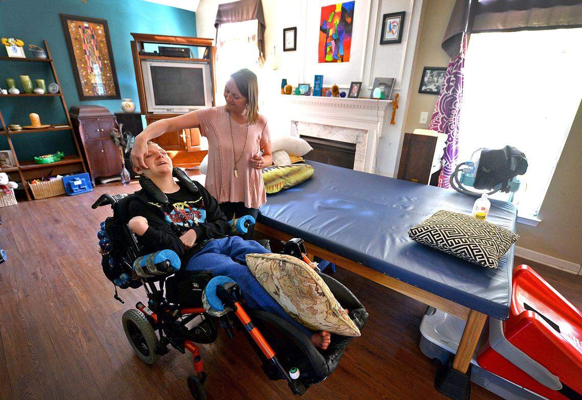 Kelly Helms, with her son, Jackson Helms, 19, on Tuesday, April 17, 2018. Jackson was supposed to have died at age six because of complications he has. Jackson has cerebral palsy and Lennox-Gastaut syndrome, a form of severe epilepsy that can resist treatment and caused him to have up to 15 seizures a day. Since CBD was legalized, his seizures have largely gone away, his mom says. Still, the Helms family supports legalizing medical marijuana because the THC component can help pull their son out of seizure comas when they happen.