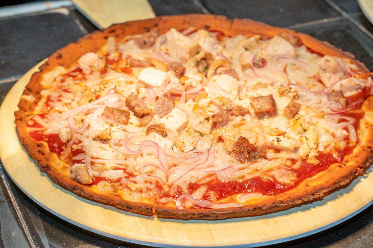 A create-your-own pizza at Brixx on gluten-free cauliflower crust.