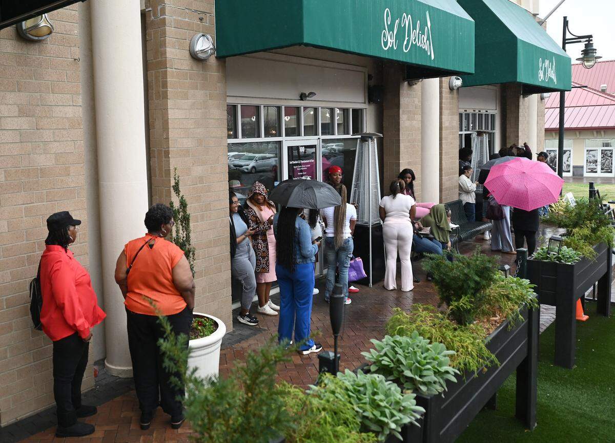 A line forms outside of Sol'Delish at The Boardwalk in University City on a recent Sunday afternoon.