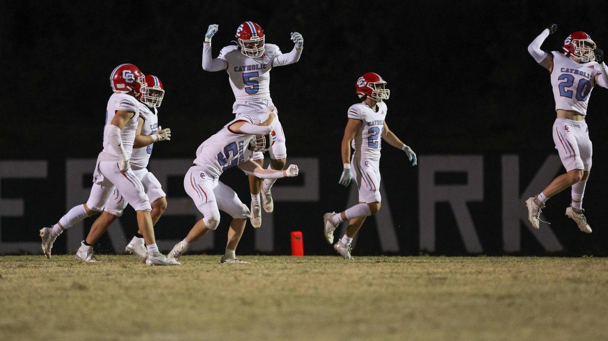 Charlotte Catholic players celebrate after scoring their third touchdown in the first half of the game against Mypers Park during the first round of the NCHSAA playoffs at Myers Park High School on Friday, November 3, 2023.