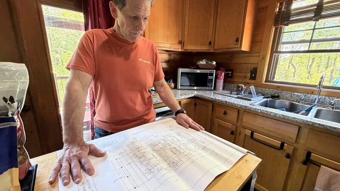 Law firm drops log cabin seller after Observer investigation, citing ‘millions’ owed
