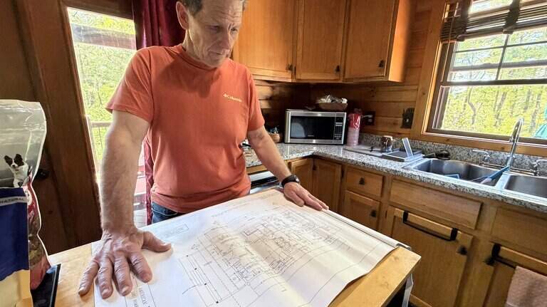 Law firm drops log cabin seller after Observer investigation, citing ‘millions’ owed