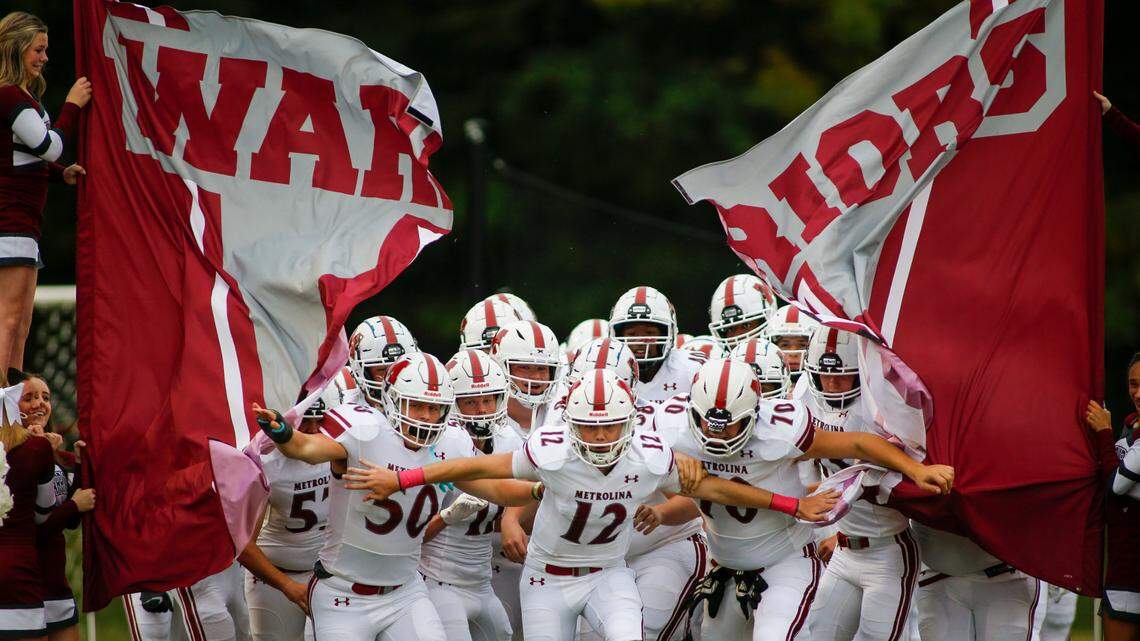 Metrolina Christian Academy players run onto the field before a game against Covenant Day in Matthews, N.C., Friday, Oct. 9, 2020. (Nell Redmond photo)