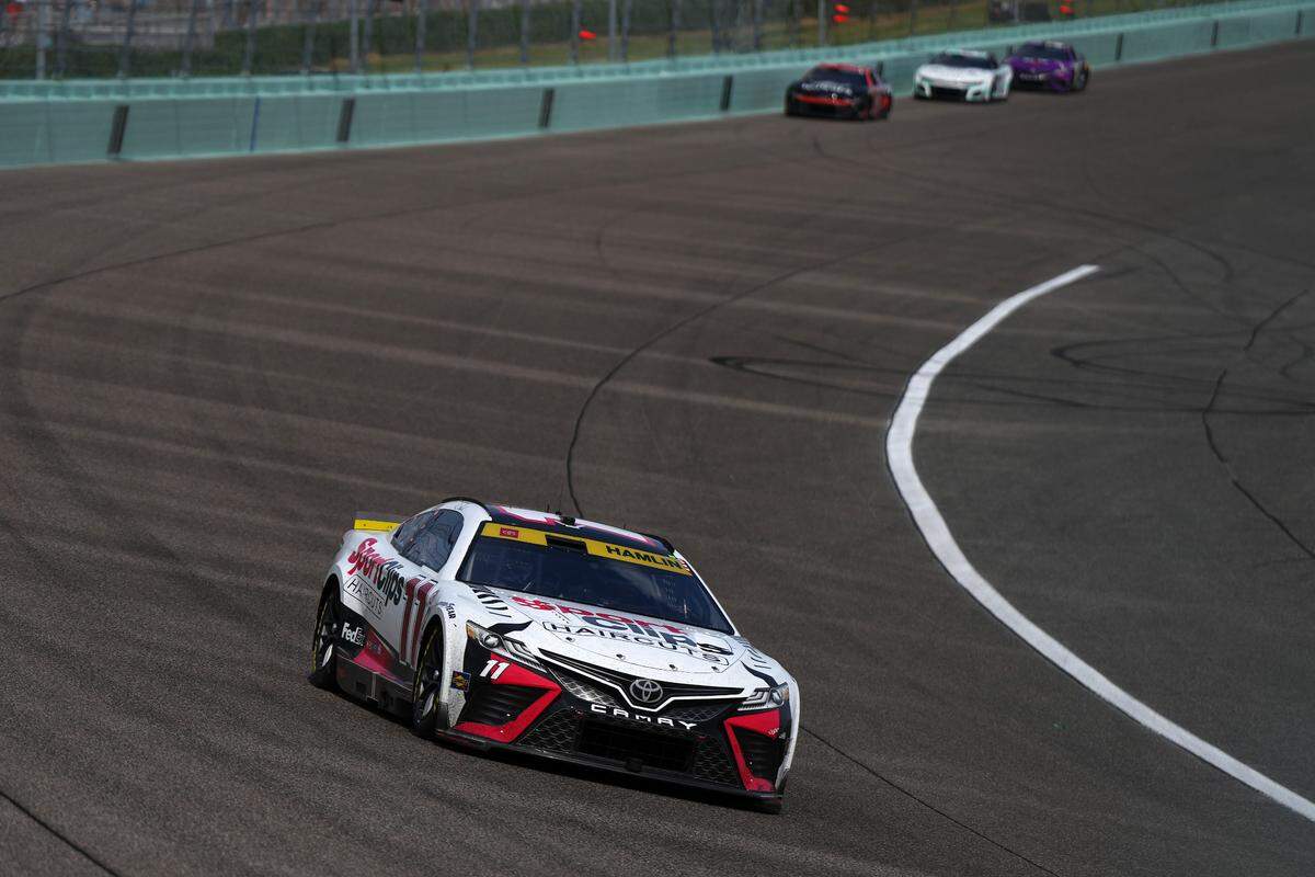 Oct 22, 2023; Homestead, Florida, USA; NASCAR Cup Series driver Denny Hamlin (11) races during the 4EVER 400 presented by Mobil 1 at Homestead-Miami Speedway. Mandatory Credit: Jasen Vinlove-USA TODAY Sports