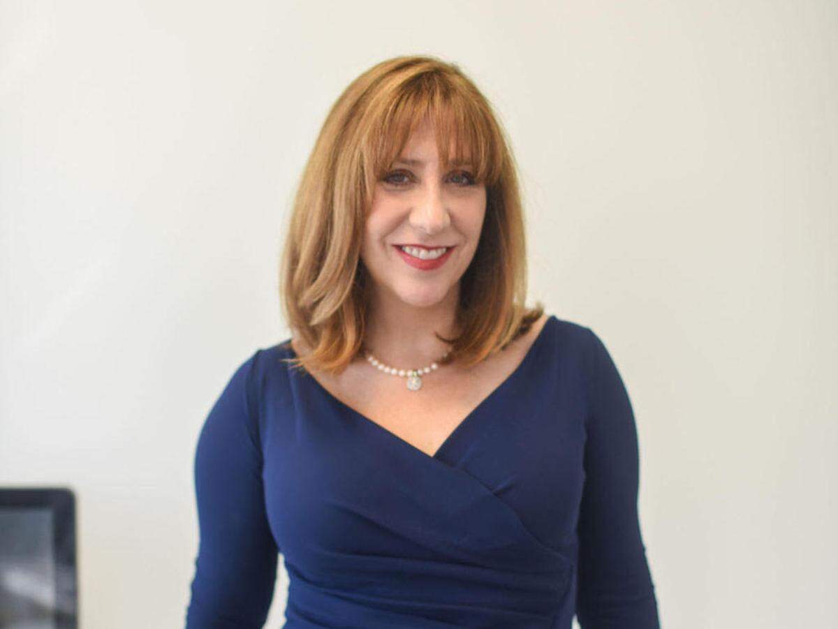 Matchmaker Laurie Berzack goes through dating prospects clients and help them with reaching out.