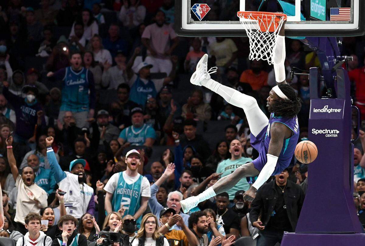 The home fans cheer as Charlotte Hornets center Montrezl Harrell finishes off a slam dunk during second-half action against the Washington Wizards at Spectrum Center in Charlotte, NC on Sunday, April 10, 2022. The Hornets defeated the Wizards, 124-108, with Harrell contributing eight points.