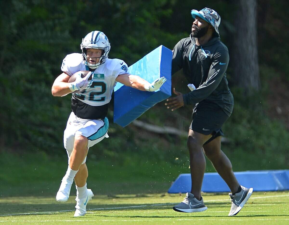 Carolina Panthers running back Christian McCaffrey breaks around a pad following a pass reception during practice on Monday, August 8, 2022 at Wofford College in Spartanburg, SC.
