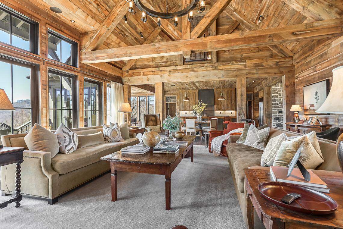 The home boasts reclaimed wood and stone accents throughout on the ceilings, walls and floors.