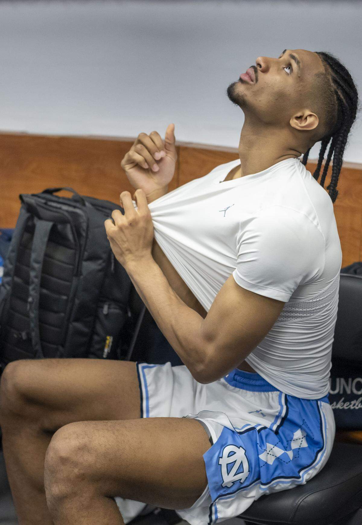 North Carolina forward Jarin Stevenson (15) removes his uniform in the locker room following the Tar Heels’ 82-78 overtime loss to VCU on Thursday.