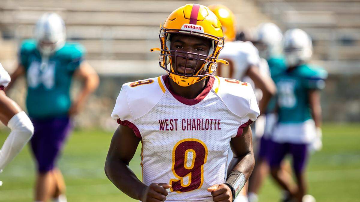 West Charlotte quarterback KD Smith comes off the field after throwing a touch down